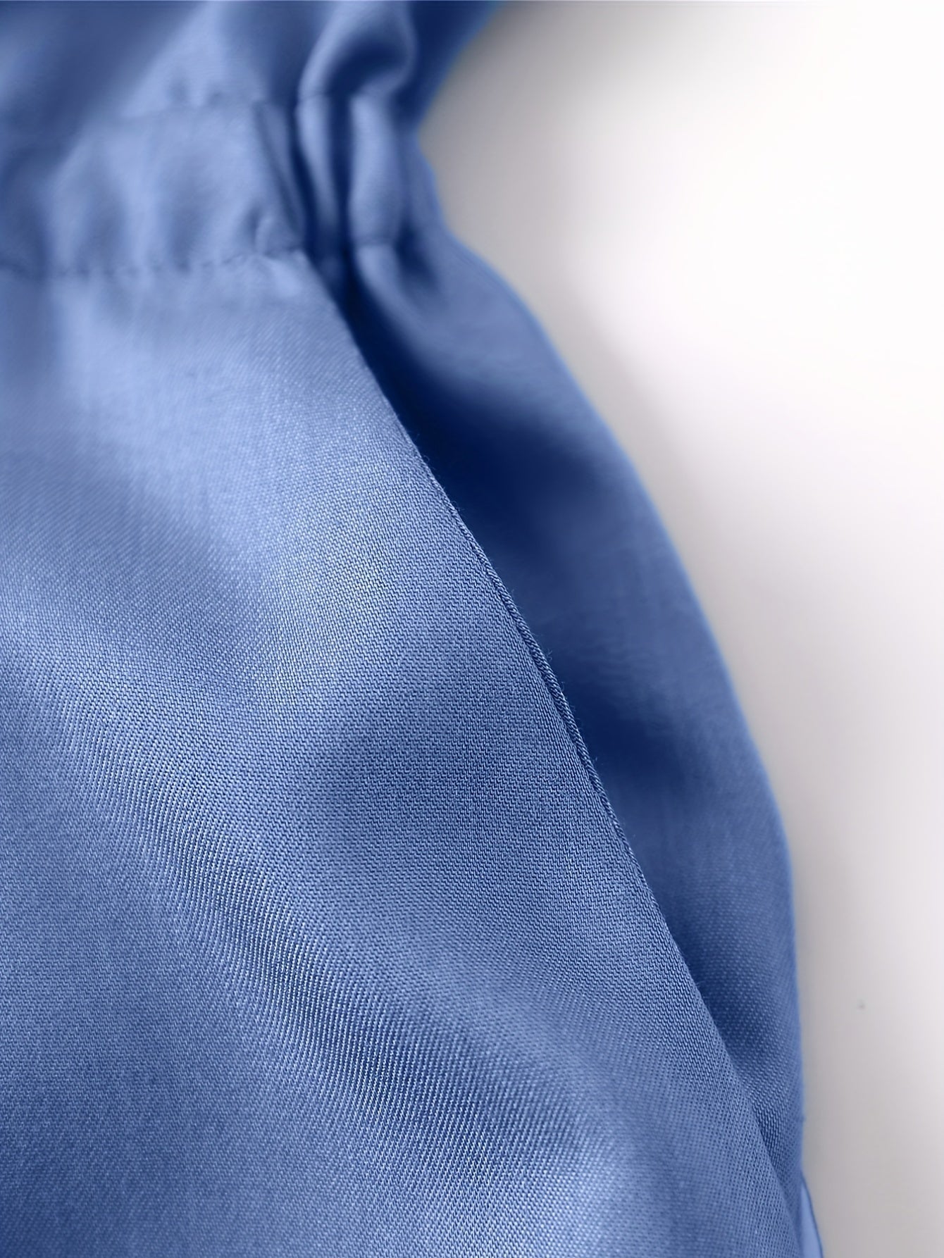 Denim jumpsuit med dragkedja fram och midjeband