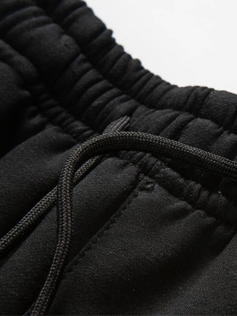 tröja med dragsko och joggingbyxor för män