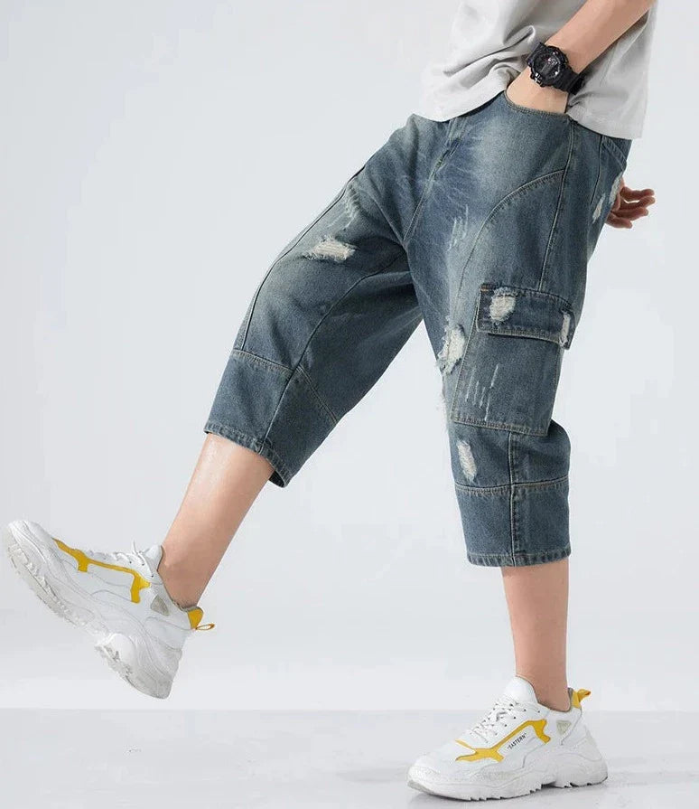 Lösa slitna jeansshorts
