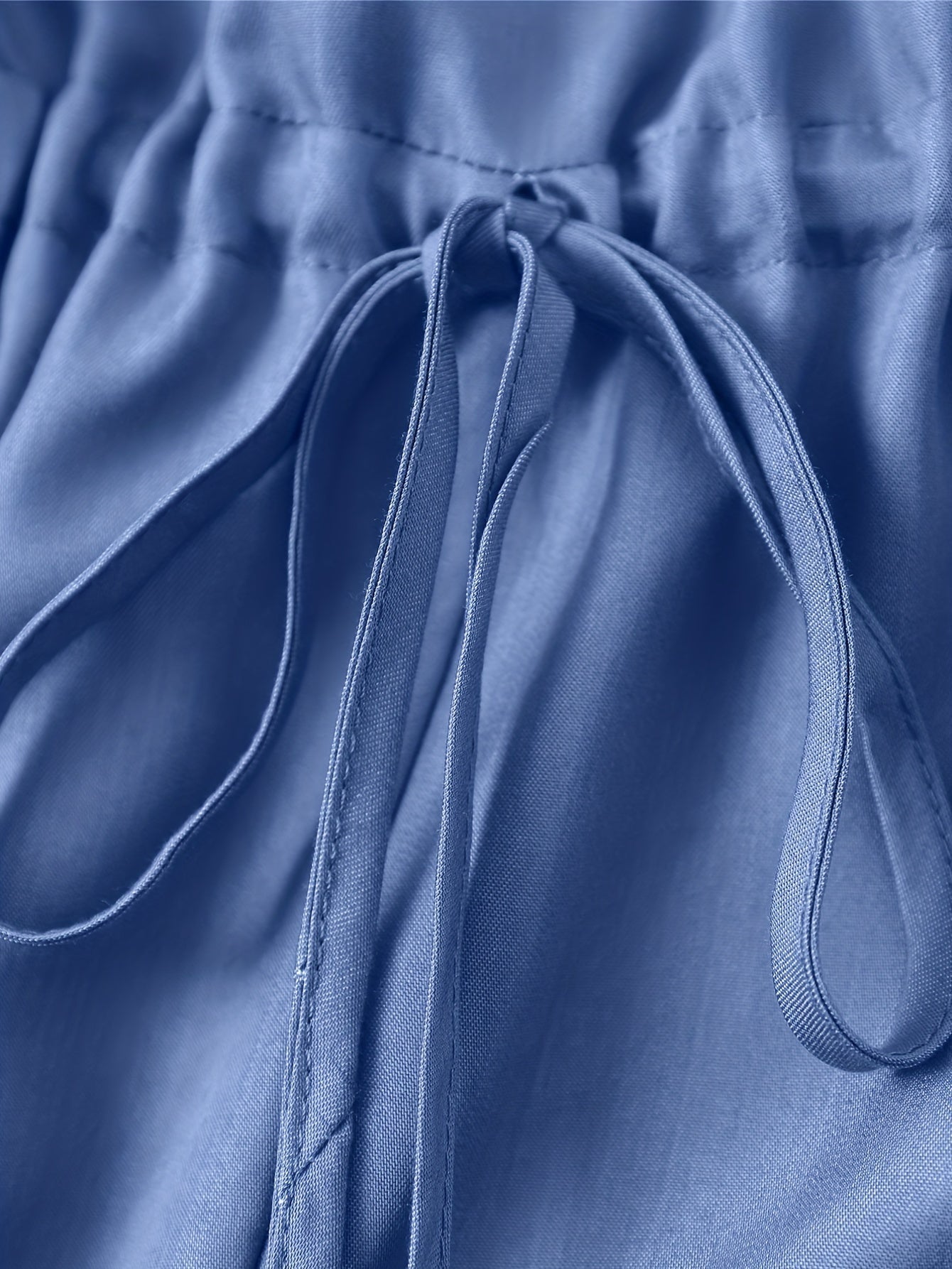 Denim jumpsuit med dragkedja fram och midjeband