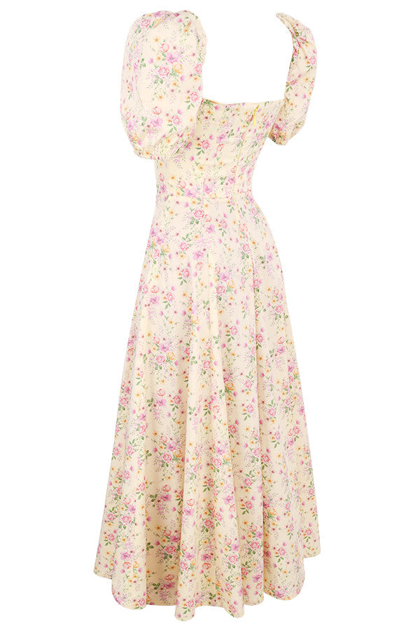 Midi solklänning med blommiga puffärmar