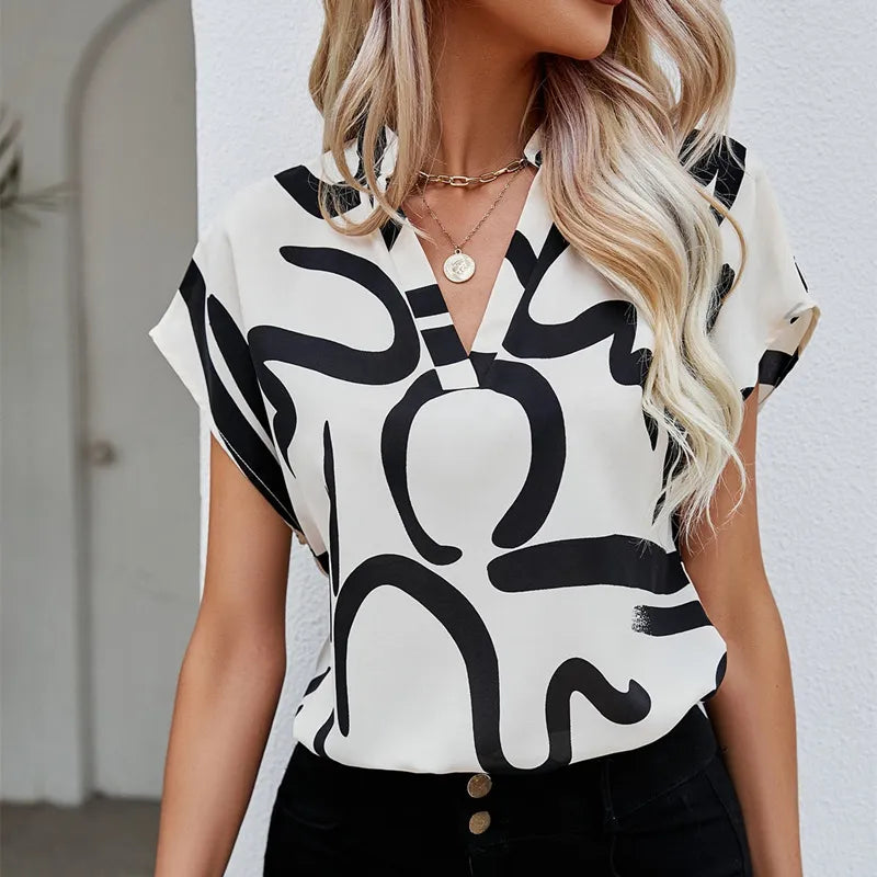 Elegant blus med grafiskt tryck