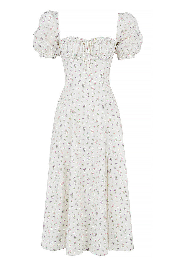Midi solklänning med blommiga puffärmar
