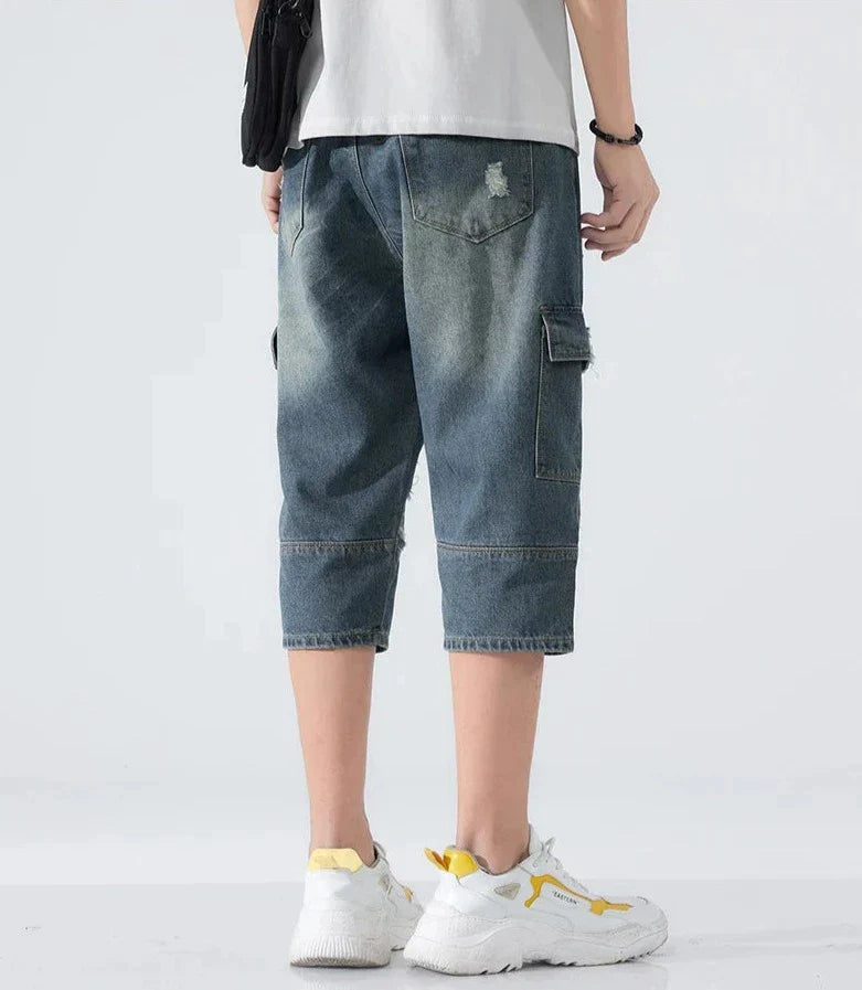 Lösa slitna jeansshorts