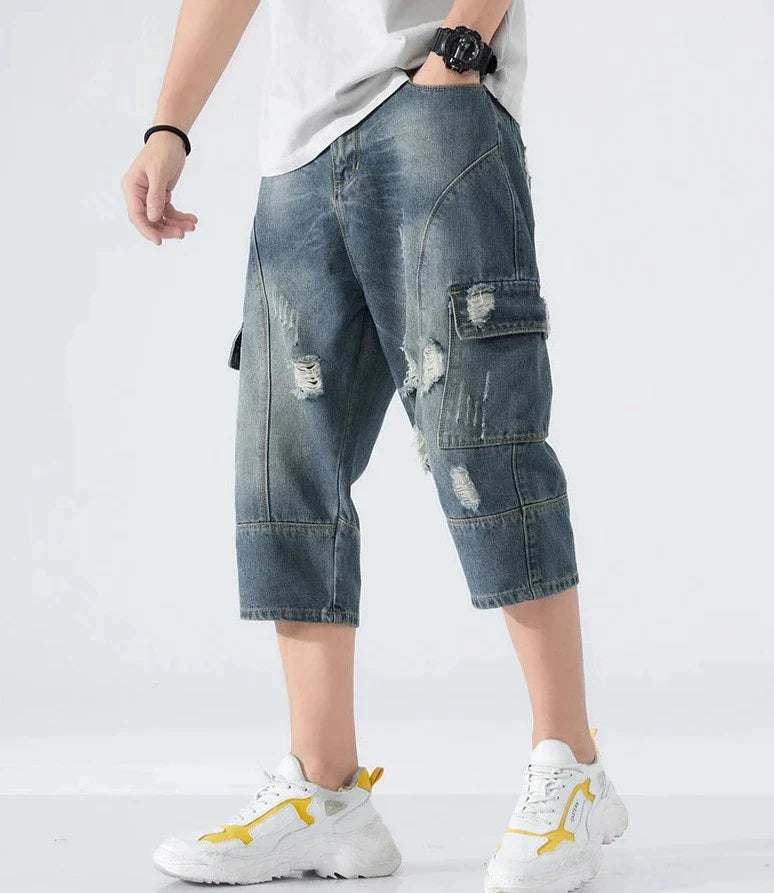 Lösa slitna jeansshorts