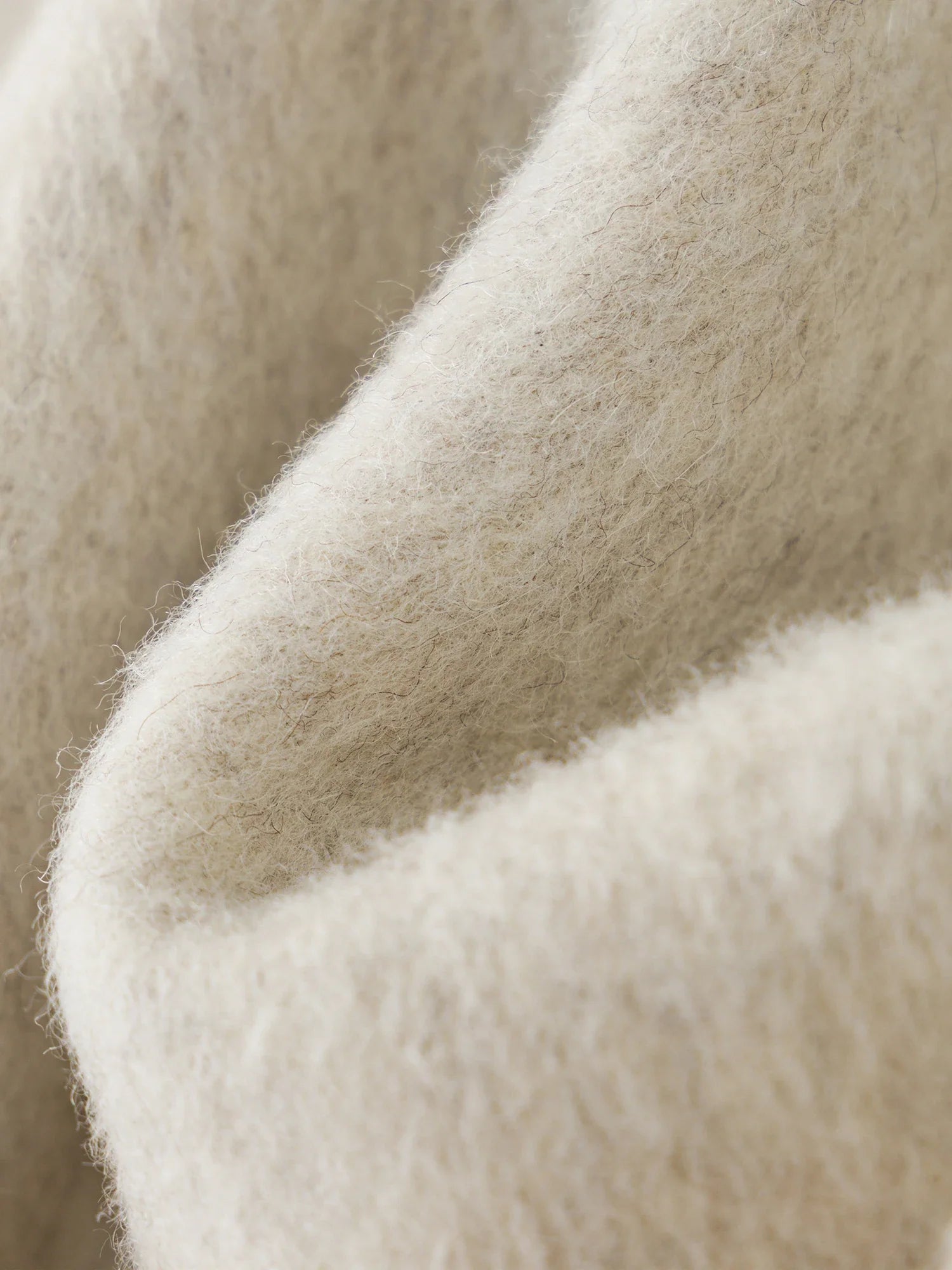 Liten dubbelsidig ullkappa