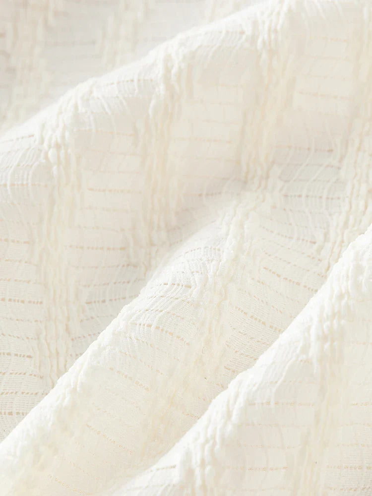 Tunn stickad ärmlös vit topp