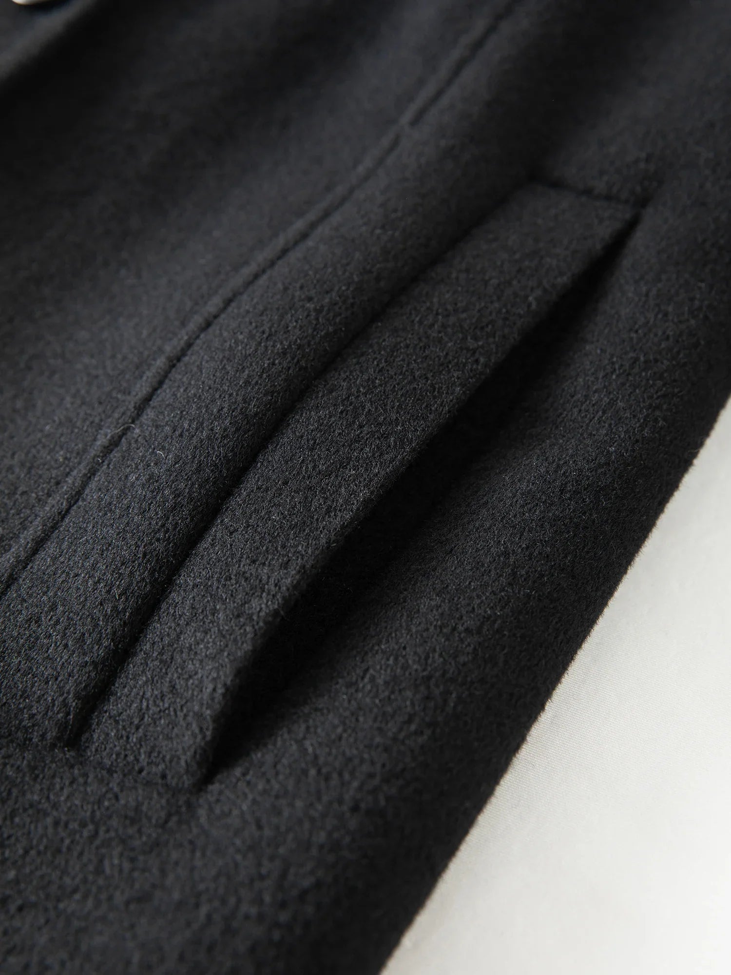 Lång ullkappa med dubbelsidig design