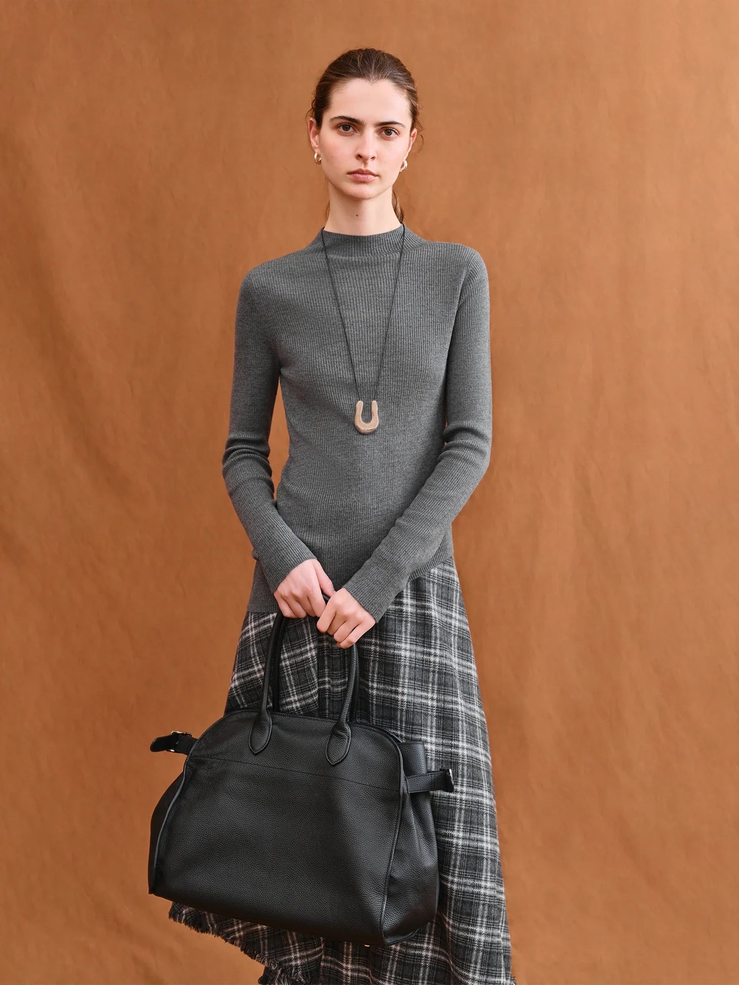 Asymmetrisk stickad ulltröja