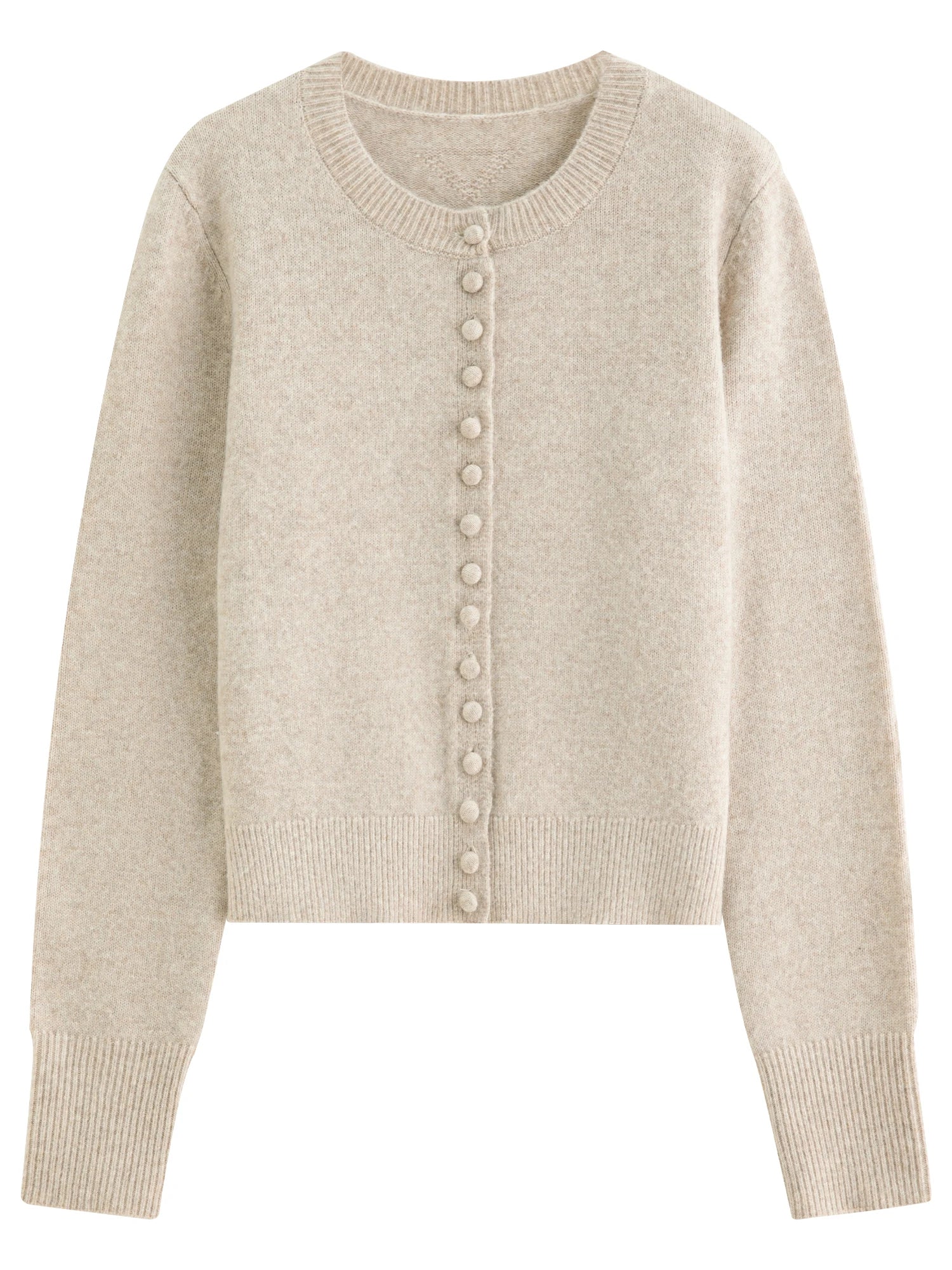 Stickad kofta i blandad stickning med ullknappar