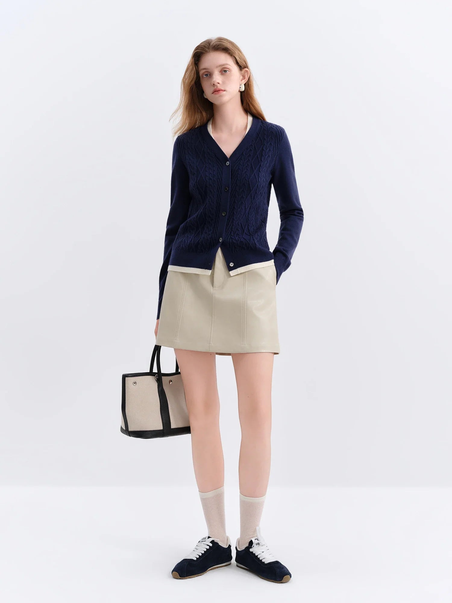 Stickad kofta i två delar