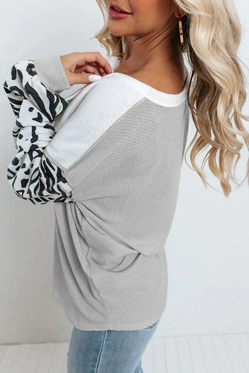 Patchwork vå ffelstickad topp med leopardärmar