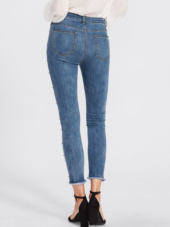 Jeans med vita pärlor