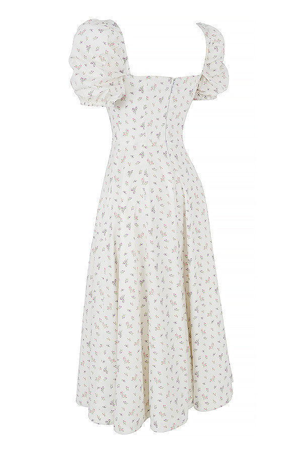 Midi solklänning med blommiga puffärmar