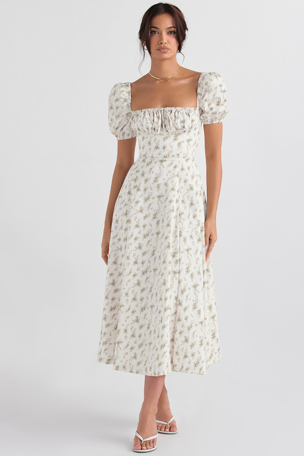 Midi solklänning med blommiga puffärmar